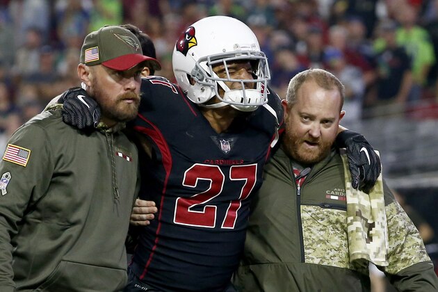 Arizona Cardinals strong safety Tyvon Branch (27) is helped off the field after an injury during the first half of an NFL football game against the Seattle Seahawks, Thursday, Nov. 9, 2017, in Glendale, Ariz. (AP Photo/Ross D. Franklin)