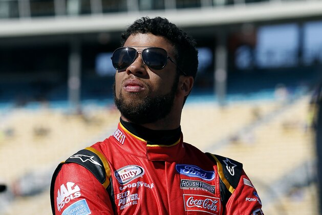 FILE - In this March 12, 2016, file photo, Darrell Wallace Jr. looks on from pit road during NASCAR Xfinity Series qualifying at Phoenix International Raceway in Avondale, Ariz. Darrell Wallace Jr. will become the first black driver to race at NASCAR's top level since 2006 when he replaces injured Aric Almirola this weekend at Pocono Raceway. (AP Photo/Ralph Freso, File)
