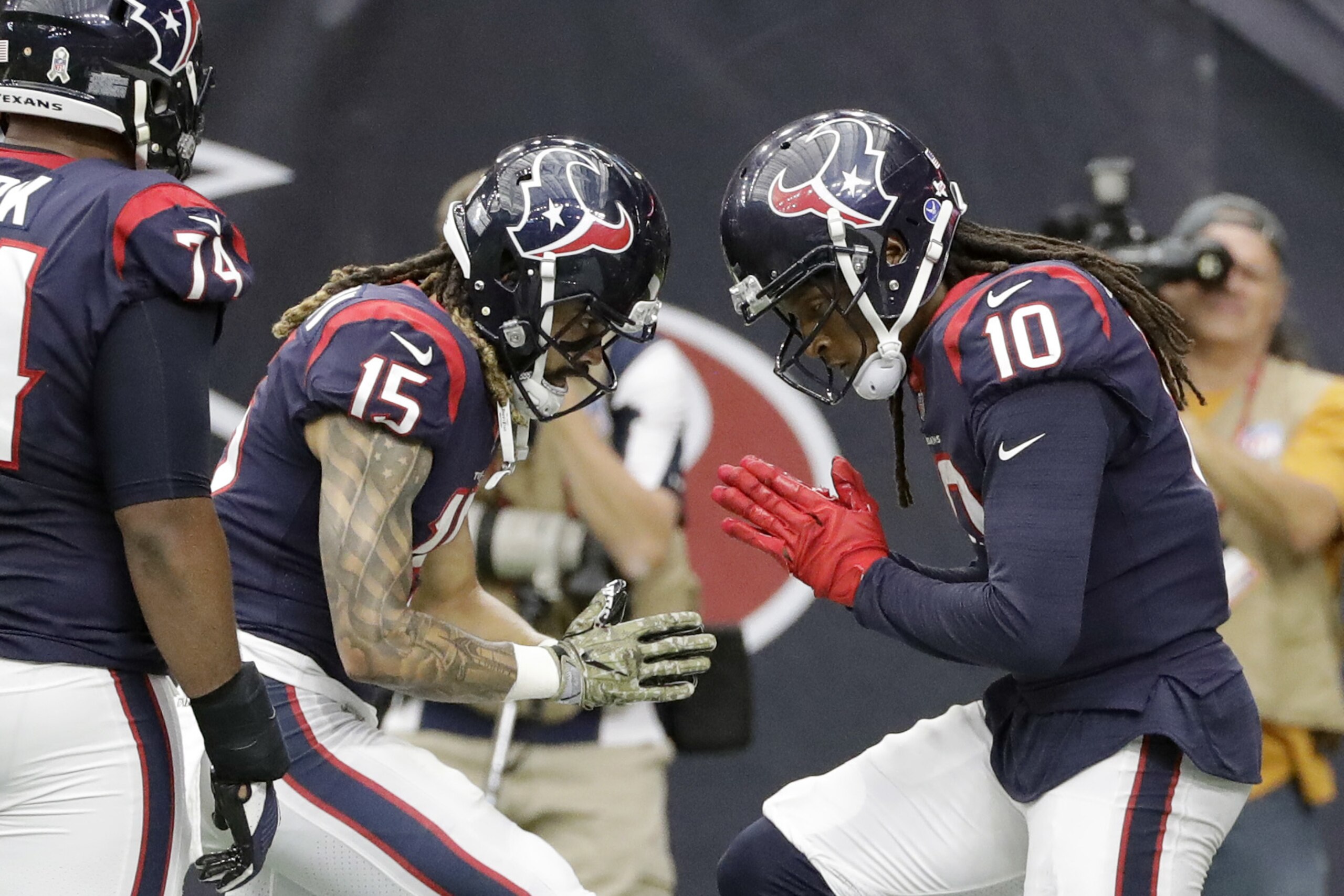 Houston Texans wide receiver DeAndre Hopkins (10) celebrates his touchdown with teammate Will Fuller (15) during the second half of an NFL football game against the Indianapolis Colts, Sunday, Nov. 5, 2017, in Houston. (AP Photo/David J. Phillip)