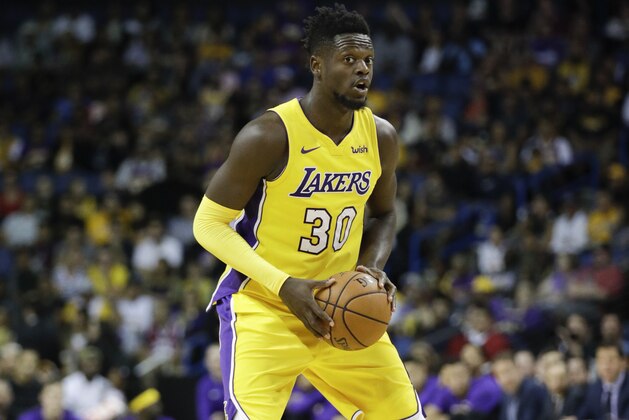Los Angeles Lakers' Julius Randle looks to pass during the second half of an NBA preseason basketball game against the Denver Nuggets, Wednesday, Oct. 4, 2017, in Ontario, Calif. (AP Photo/Jae C. Hong)