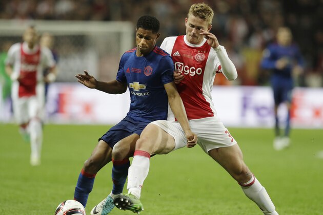 Manchester's Marcus Rashford, left, and Ajax's Matthijs de Ligt challenge for the ball during the soccer Europa League final between Ajax Amsterdam and Manchester United at the Friends Arena in Stockholm, Sweden, Wednesday, May 24, 2017. (AP Photo/Michael Sohn)