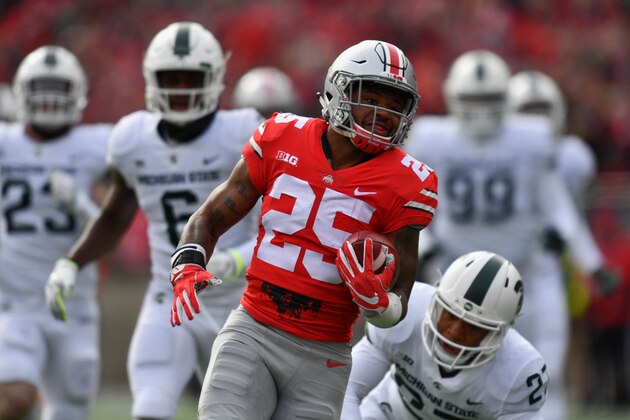 COLUMBUS, OH - NOVEMBER 11:  Mike Weber #25 of the Ohio State Buckeyes leaves the Michigan State defense behind as he completes a 47-yard touchdown run in the first quarter at Ohio Stadium on November 11, 2017 in Columbus, Ohio.  (Photo by Jamie Sabau/Getty Images)