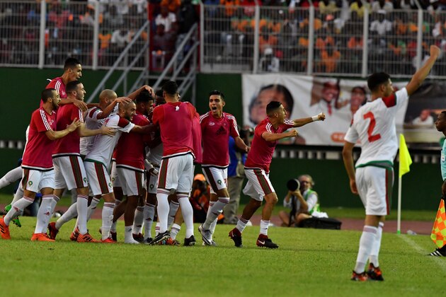 Morocco's team players celebrate at the Felix Houphouet-Boigny stadium in Abidjan on November 11, 2017, at the end of the FIFA World Cup 2018 Africa Group C qualifying football match between Ivory Coast and Morocco.  / AFP PHOTO / ISSOUF SANOGO        (Photo credit should read ISSOUF SANOGO/AFP/Getty Images)
