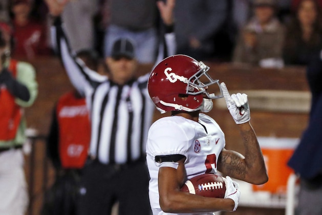 Alabama wide receiver DeVonta Smith (6) celebrates his 26-yard touchdown pass reception against Mississippi State during the second half of an NCAA college football game in Starkville, Miss., Saturday, Nov. 11, 2017. No. 2 Alabama won 31-24. (AP Photo/Rogelio V. Solis)