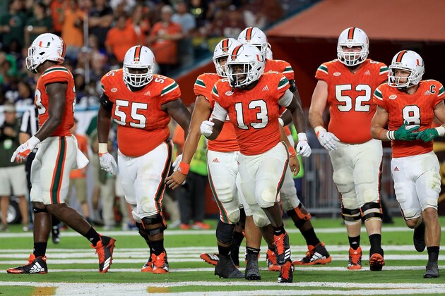 MIAMI GARDENS, FL - NOVEMBER 11:  DeeJay Dallas #13 of the Miami Hurricanes celebrates a touchdown during a game against the Notre Dame Fighting Irish at Hard Rock Stadium on November 11, 2017 in Miami Gardens, Florida.  (Photo by Mike Ehrmann/Getty Images)