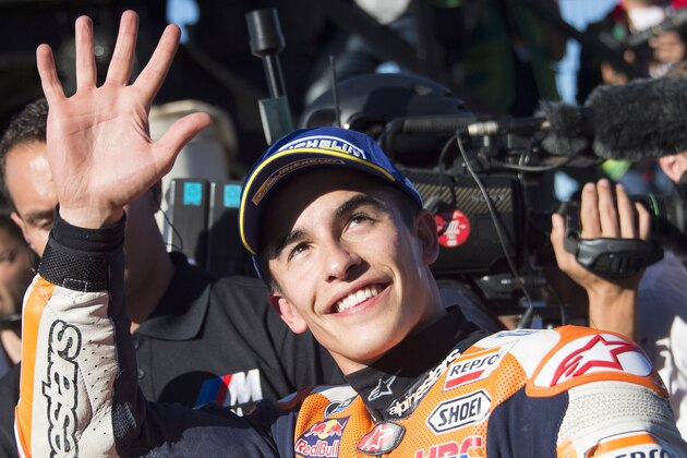 VALENCIA, SPAIN - NOVEMBER 11:  Marc Marquez of Spain and Repsol Honda Team
 celebrates the pole position in MotoGP at the end of the qualifying practice during the Comunitat Valenciana Grand Prix - Moto GP Previews at Comunitat Valenciana Ricardo Tormo Circuit on November 11, 2017 in Valencia, Spain.  (Photo by Mirco Lazzari gp/Getty Images)