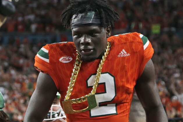 Miami defensive back Trajan Bandy (2) wears the turnover chain after getting an interception during the first half of an NCAA college football game against Notre Dame, Saturday, Nov. 11, 2017, in Miami Gardens, Fla. (AP Photo/Lynne Sladky)