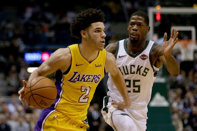 MILWAUKEE, WI - NOVEMBER 11:  Lonzo Ball #2 of the Los Angeles Lakers dribbles the ball while being guarded by DeAndre Liggins #25 of the Milwaukee Bucks in the fourth quarter at the Bradley Center on November 11, 2017 in Milwaukee, Wisconsin. NOTE TO USER: User expressly acknowledges and agrees that, by downloading and or using this photograph, User is consenting to the terms and conditions of the Getty Images License Agreement. (Photo by Dylan Buell/Getty Images)