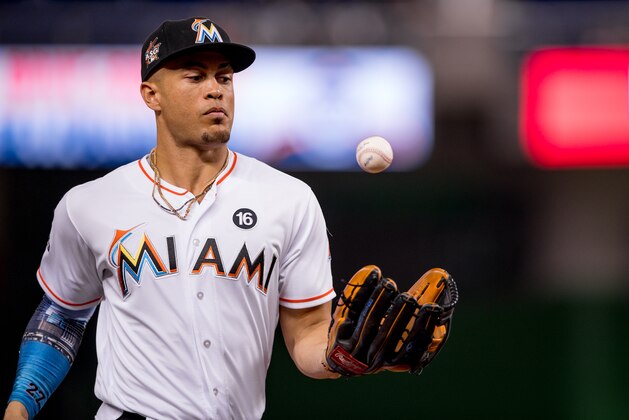 MIAMI, FL - SEPTEMBER 29: Giancarlo Stanton #27 of the Miami Marlins tosses a ball in the air during the game against the Atlanta Braves at Marlins Park on September 29, 2017 in Miami, Florida. (Photo by Rob Foldy/Miami Marlins via Getty Images)
