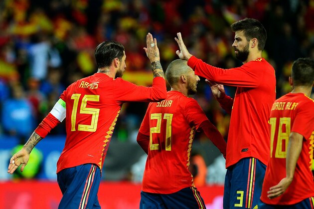 Spain's defender Sergio Ramos (L) celebrates with Spain's defender Gerard Pique (R) after Spain's forward Alvaro Morata scored a goal during the international friendly football match Spain against Costa Rica at La Rosaleda stadium in Malaga on November 11, 2017.  / AFP PHOTO / CRISTINA QUICLER        (Photo credit should read CRISTINA QUICLER/AFP/Getty Images)