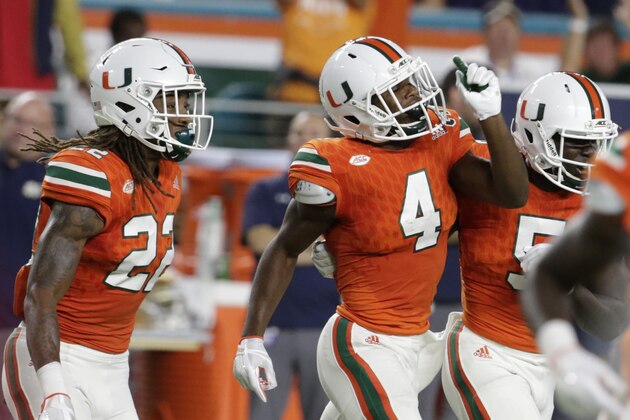 Miami defensive back Jaquan Johnson (4) celebrates after intercepting Notre Dame quarterback Brandon Wimbush during the first half of an NCAA college football game, Saturday, Nov. 11, 2017, in Miami Gardens, Fla. (AP Photo/Lynne Sladky)