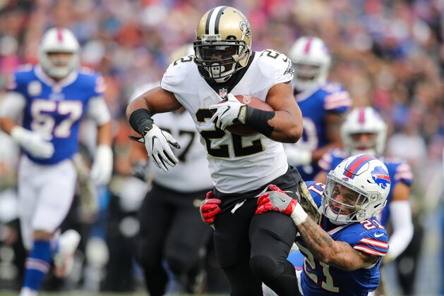 ORCHARD PARK, NY - NOVEMBER 12:  Mark Ingram #22 of the New Orleans Saints runs the ball as Jordan Poyer #21 of the Buffalo Bills attempts to tackle him during the first quarter on November 12, 2017 at New Era Field in Orchard Park, New York.  (Photo by Brett Carlsen/Getty Images)