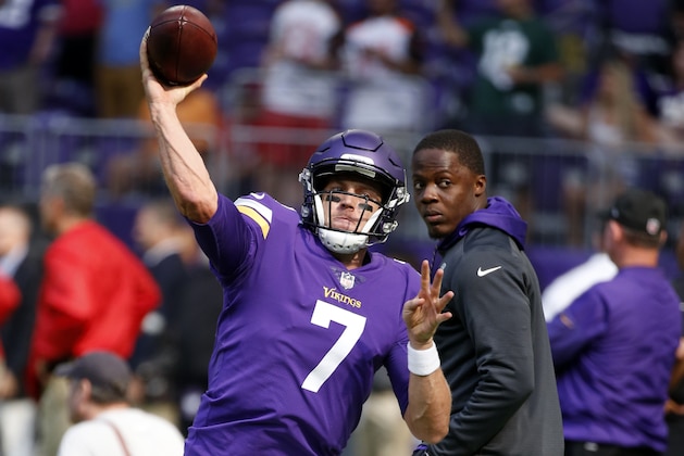 Minnesota Vikings quarterback Case Keenum (7) warms up as teammate Teddy Bridgewater, right, looks on before an NFL football game against the Tampa Bay Buccaneers, Sunday, Sept. 24, 2017, in Minneapolis. (AP Photo/Bruce Kluckhohn)