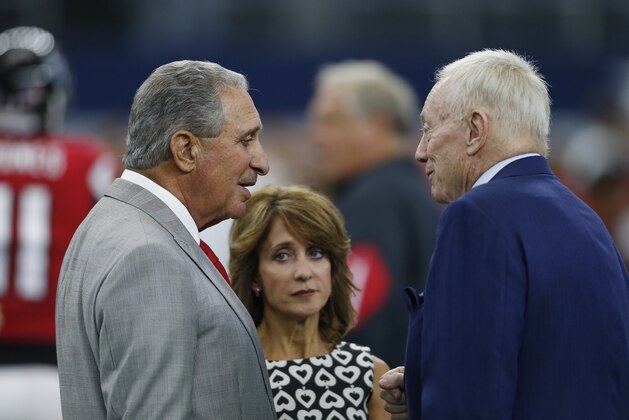 Atlanta Falcons owner Arthur Blank, left, talks to Dallas Cowboys owner Jerry Jones, right, prior to a NFL football game on Sunday, Sept. 27, 2015, in Arlington, Texas. (AP Photo/Brandon Wade)