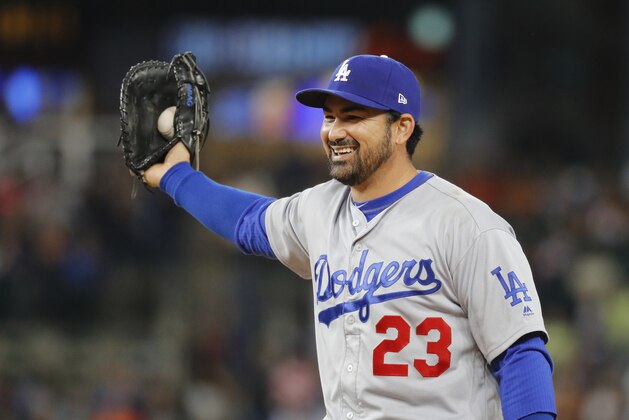 Los Angeles Dodgers first baseman Adrian Gonzalez smiles after catching a Detroit Tigers' Ian Kinsler line drive in the eighth inning of a baseball game in Detroit, Friday, Aug. 18, 2017. (AP Photo/Paul Sancya)
