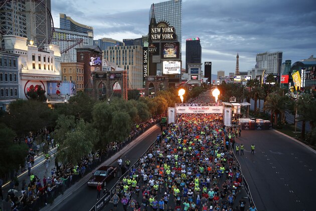 Runners start the Rock 'n' Roll Las Vegas Marathon along the Strip, Sunday, Nov. 12, 2017, in Las Vegas. (AP Photo/John Locher)