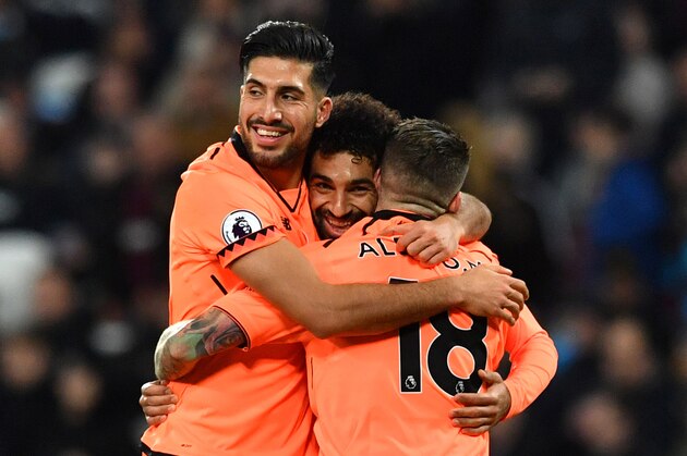 Liverpool's Egyptian midfielder Mohamed Salah (C) celebrates after scoring with Liverpool's German midfielder Emre Can (L) and Liverpool's Spanish defender Alberto Moreno during the English Premier League football match between West Ham United and Liverpool at The London Stadium, in east London on November 4, 2017. / AFP PHOTO / Ben STANSALL / RESTRICTED TO EDITORIAL USE. No use with unauthorized audio, video, data, fixture lists, club/league logos or 'live' services. Online in-match use limited to 75 images, no video emulation. No use in betting, games or single club/league/player publications.  /         (Photo credit should read BEN STANSALL/AFP/Getty Images)