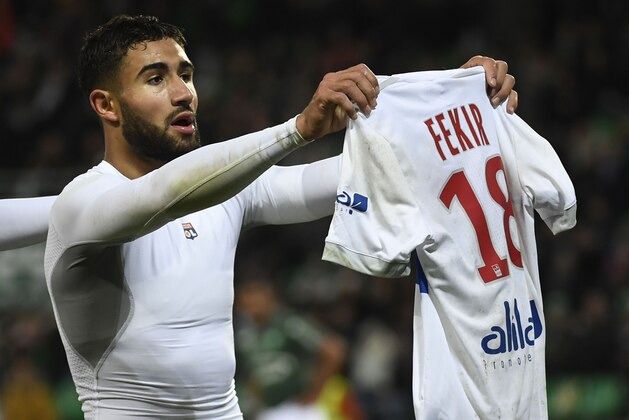 Lyon's French midfielder Nabil Fekir shows his shirt after scoring during the French L1 football match between AS Saint-Etienne and Olympique Lyonnais, on November 5, 2017, at the Geoffroy Guichard stadium in Saint-Etienne, central France.    / AFP PHOTO / PHILIPPE DESMAZES        (Photo credit should read PHILIPPE DESMAZES/AFP/Getty Images)