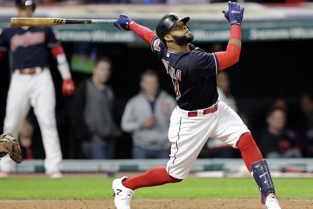 Cleveland Indians' Carlos Santana watches his one-run double off Baltimore Orioles starting pitcher Wade Miley in the sixth inning of a baseball game, Friday, Sept. 8, 2017, in Cleveland. Yandy Diaz scored on the play. (AP Photo/Tony Dejak)