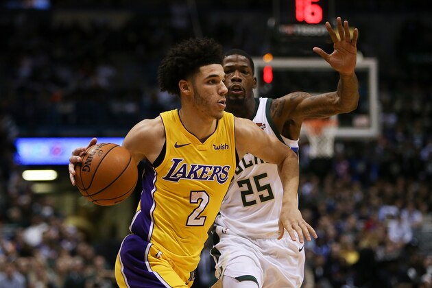MILWAUKEE, WI - NOVEMBER 11:  Lonzo Ball #2 of the Los Angeles Lakers dribbles the ball while being guarded by DeAndre Liggins #25 of the Milwaukee Bucks in the fourth quarter at the Bradley Center on November 11, 2017 in Milwaukee, Wisconsin. NOTE TO USER: User expressly acknowledges and agrees that, by downloading and or using this photograph, User is consenting to the terms and conditions of the Getty Images License Agreement. (Photo by Dylan Buell/Getty Images)