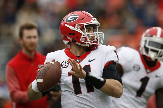 Georgia quarterback Jake Fromm sets back to pass before an NCAA college football game against Auburn on Saturday, Nov. 11, 2017, in Auburn, Ala. (AP Photo/Brynn Anderson)