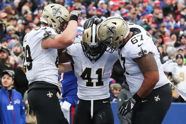 ORCHARD PARK, NY - NOVEMBER 12:  Alvin Kamara #41 of the New Orleans Saints celebrates with teammates Josh Hill #89 of the New Orleans Saints and Larry Warford #67 of the New Orleans Saints after scoring a touchdown during the fourth quarter on November 12, 2017 at New Era Field in Orchard Park, New York.  (Photo by Tom Szczerbowski/Getty Images)