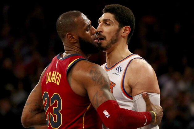 NEW YORK, NY - NOVEMBER 13:  LeBron James #23 of the Cleveland Cavaliers and Enes Kanter #00 of the New York Knicks exchange words in the first half at Madison Square Garden on November 13, 2017 in New York City. NOTE TO USER: User expressly acknowledges and agrees that, by downloading and or using this Photograph, user is consenting to the terms and conditions of the Getty Images License Agreement  (Photo by Elsa/Getty Images)