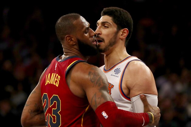 NEW YORK, NY - NOVEMBER 13:  LeBron James #23 of the Cleveland Cavaliers and Enes Kanter #00 of the New York Knicks exchange words in the first half at Madison Square Garden on November 13, 2017 in New York City. NOTE TO USER: User expressly acknowledges and agrees that, by downloading and or using this Photograph, user is consenting to the terms and conditions of the Getty Images License Agreement  (Photo by Elsa/Getty Images)