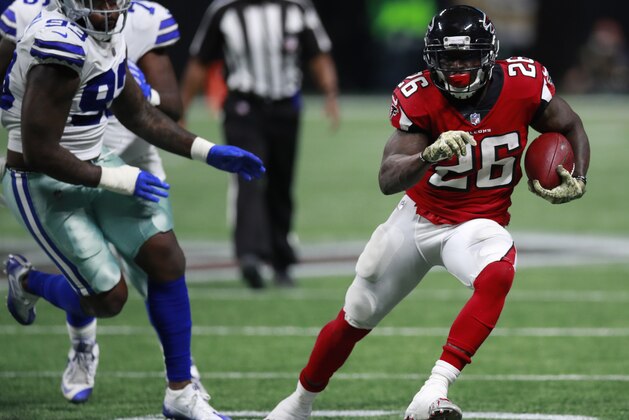 Atlanta Falcons running back Tevin Coleman (26) runs the ball against the Dallas Cowboys during an NFL football game, Sunday, November 12, 2017, in Atlanta. The Falcons won 27-7. (Jeff Haynes/AP Images for Panini)