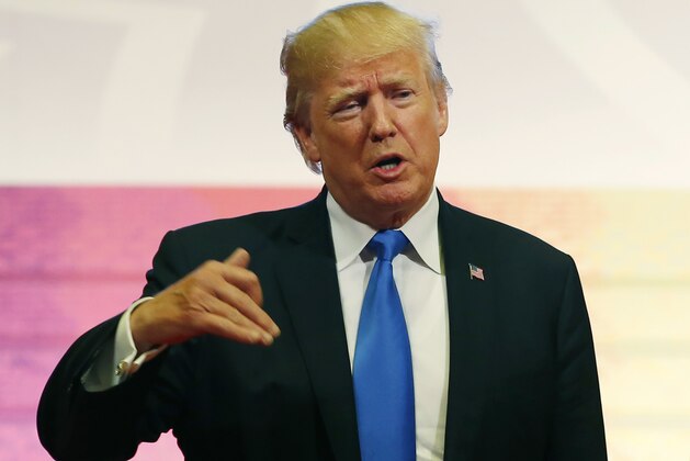 U.S. President Donald Trump gestures as he talks about his 12-day Asian tour that brought him to five countries in Asia, with the final stop in the Philippines for ASEAN Summit Tuesday, Nov. 14, 2017 in Manila, Philippines. (AP Photo/Bullit Marquez)