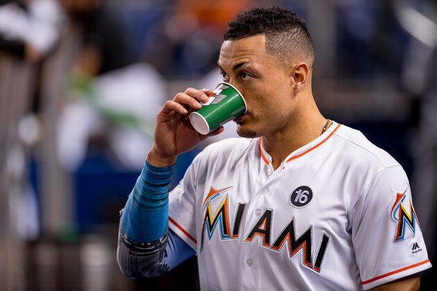 MIAMI, FL - SEPTEMBER 29: Giancarlo Stanton #27 of the Miami Marlins drinks from a Gatorade cup during the game against the Atlanta Braves at Marlins Park on September 29, 2017 in Miami, Florida. (Photo by Rob Foldy/Miami Marlins via Getty Images)