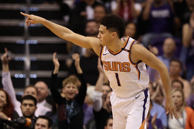 PHOENIX, AZ - NOVEMBER 13:  Devin Booker #1 of the Phoenix Suns reacts after hitting a three point shot against the Los Angeles Lakers during the first half of the NBA game at Talking Stick Resort Arena on November 13, 2017 in Phoenix, Arizona. NOTE TO USER: User expressly acknowledges and agrees that, by downloading and or using this photograph, User is consenting to the terms and conditions of the Getty Images License Agreement.  (Photo by Christian Petersen/Getty Images)