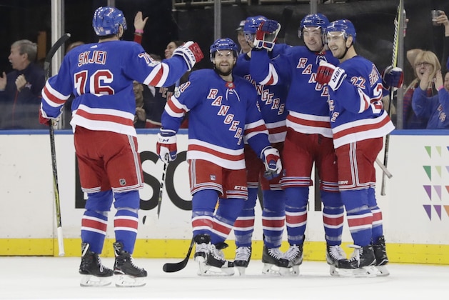 New York Rangers' Brady Skjei (76) joins teammates as they celebrate the second goal of the game by Jimmy Vesey, against the Boston Bruins during the first period of an NHL hockey game Wednesday, Nov. 8, 2017, in New York. (AP Photo/Frank Franklin II)