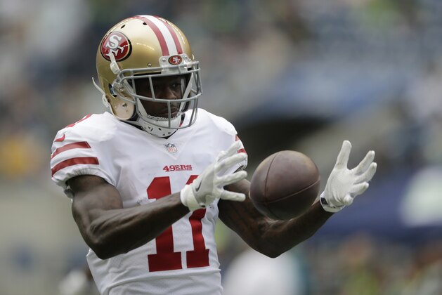 San Francisco 49ers wide receiver Marquise Goodwin holds the football during warmups before an NFL football game against the Seattle Seahawks, Sunday, Sept. 17, 2017, in Seattle. (AP Photo/John Froschauer)