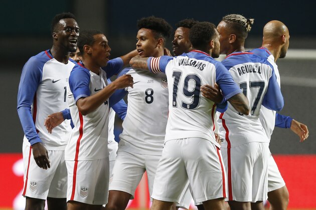 U.S. player Weston McKennie, center, celebrates with team mates after scoring the opening goal during an international friendly soccer match between Portugal and U.S. at the Dr. Magalhaes Pessoa stadium in Leiria, Portugal, Tuesday Nov. 14, 2017. (AP Photo/Pedro Rocha)