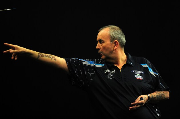 EXETER, ENGLAND - MARCH 05:  Phil Taylor of England competes against James Wade of England during The Betway Premier League Darts at Westpoint Arena on March 5, 2015 in Exeter, England.  (Photo by Dan Mullan/Getty Images)