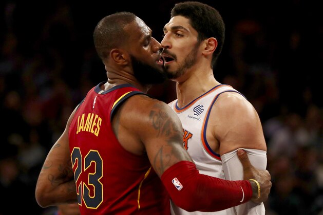 NEW YORK, NY - NOVEMBER 13:  LeBron James #23 of the Cleveland Cavaliers and Enes Kanter #00 of the New York Knicks exchange words in the first half at Madison Square Garden on November 13, 2017 in New York City. NOTE TO USER: User expressly acknowledges and agrees that, by downloading and or using this Photograph, user is consenting to the terms and conditions of the Getty Images License Agreement  (Photo by Elsa/Getty Images)