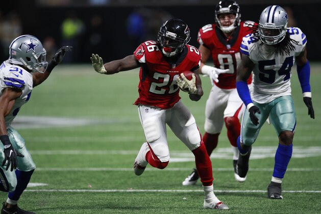 Atlanta Falcons running back Tevin Coleman (26) runs the ball against the Dallas Cowboys during an NFL football game, Sunday, November 12, 2017, in Atlanta. The Falcons won 27-7. (Jeff Haynes/AP Images for Panini)