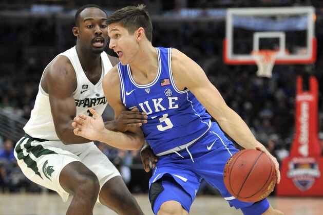 Duke guard Grayson Allen (3) drives on Michigan State guard Joshua Langford during the first half of an NCAA college basketball game Tuesday, Nov. 14, 2017, in Chicago. (AP Photo/Paul Beaty)