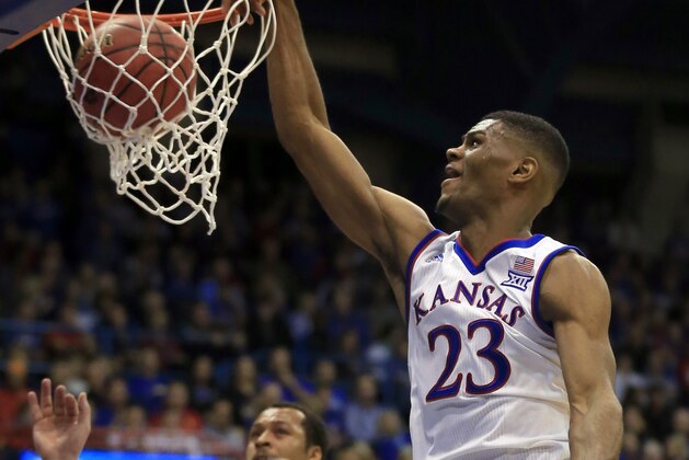 Kansas forward Billy Preston (23) dunks over Pittsburg State forward Jonathan Murray (45) during the first half of an exhibition NCAA college basketball game in Lawrence, Kan., Tuesday, Oct. 31, 2017. (AP Photo/Orlin Wagner)