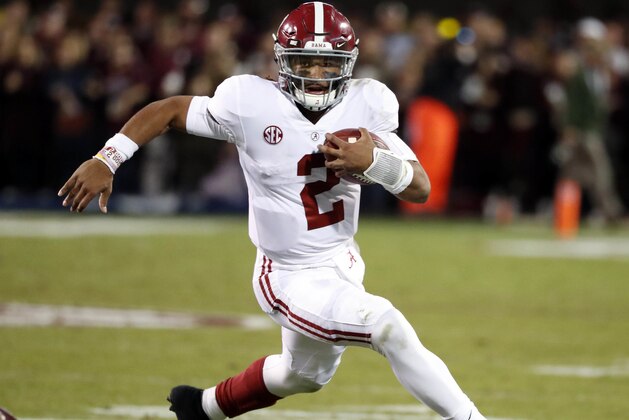 Alabama quarterback Jalen Hurts carries for a short gain against Mississippi State during the second half of an NCAA college football game in Starkville, Miss., Saturday, Nov. 11, 2017. Alabama won 31-24. (AP Photo/Rogelio V. Solis)