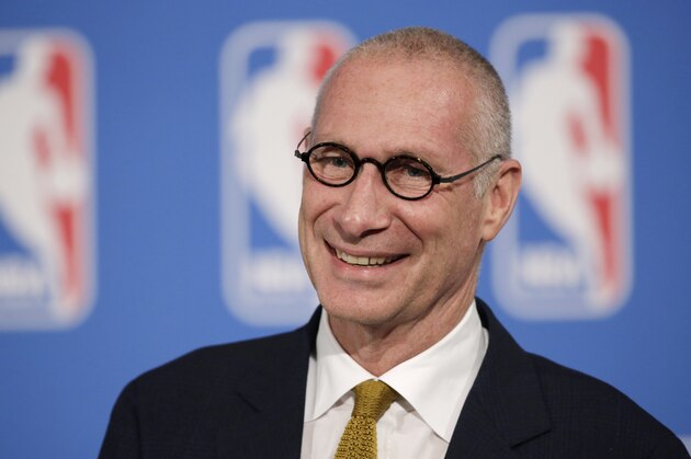 FILE - In this Oct. 6, 2014, file photo, ESPN President John Skipper smiles during a news conference in New York. TV executives in the U.S. and Canada have long argued that the best value for your money comes through packages of hundreds of channels. The industry has also resisted offering full choice because overall subscription and advertising revenue could decline. “We don’t sell it alone right now because we generate more revenue by being in a larger package,” Skipper said at the recent Code Media conference. Asked if the leading sports network would cost too much on its own given the rising cost of sports rights, he replied that was “just a hypothetical and ultimately, specious mathematical problem.” (AP Photo/Mark Lennihan, File)