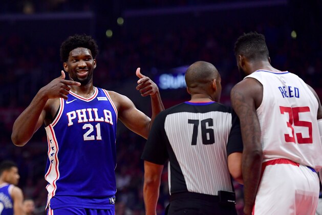 LOS ANGELES, CA - NOVEMBER 13:  Joel Embiid #21 of the Philadelphia 76ers reacts to Willie Reed #35 of the LA Clippers during a 109-105 76er win at Staples Center on November 13, 2017 in Los Angeles, California.  (Photo by Harry How/Getty Images)