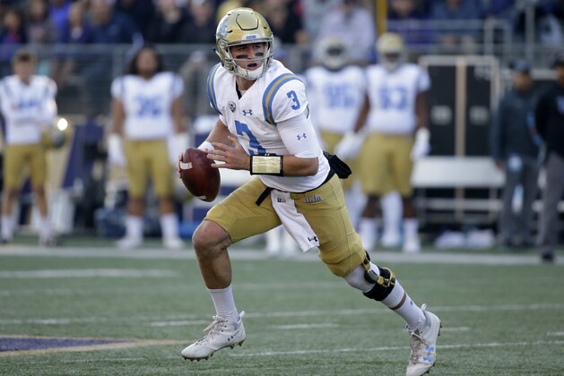 UCLA quarterback Josh Rosen scrambles against Washington in the first half of an NCAA college football game Saturday, Oct. 28, 2017, in Seattle. (AP Photo/Elaine Thompson)