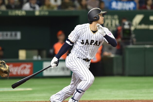 Designated hitter Shohei Ohtani of Japan follows his solo homer in the fifth inning during the international friendly baseball match between Japan and the Netherlands at the Tokyo Dome on November 12, 2016. / AFP / KAZUHIRO NOGI        (Photo credit should read KAZUHIRO NOGI/AFP/Getty Images)