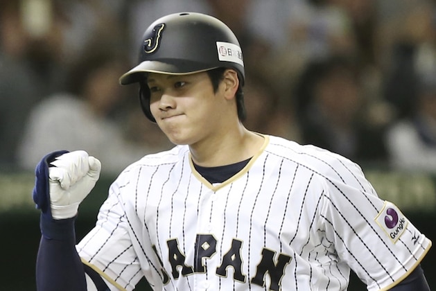 FILE - In this Nov. 12, 2016, file photo, Japan's designated hitter Shohei Otani reacts after hitting a solo home run off Netherlands' starter Jair Jurrjens in the fifth inning of their international exhibition series baseball game at Tokyo Dome in Tokyo. Texas, the New York Yankees and Minnesota can pay the most to an international free agent as highly touted pitcher-outfielder Shohei Otani prepares to enter the market, and Major League Baseball and its Japanese counterpart have agreed to the outlines of a deal to keep the old posting system for this offseason. (AP Photo/Koji Sasahara, File)