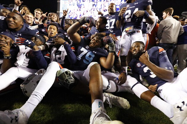 Auburn defensive lineman Andrew Williams (79) celebrates with the team after a 40-17 win over Georgia in an NCAA college football game on Saturday, Nov. 11, 2017, in Auburn, Ala. (AP Photo/Brynn Anderson)
