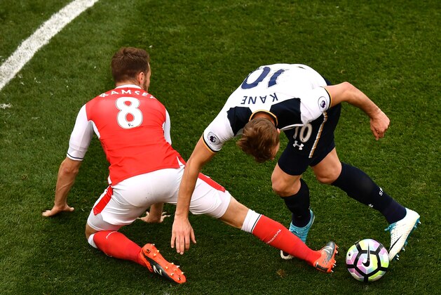 LONDON, ENGLAND - APRIL 30: Aaron Ramsey of Arsenal and Harry Kane of Tottenham Hotspur compete for the ball during the Premier League match between Tottenham Hotspur and Arsenal at White Hart Lane on April 30, 2017 in London, England.  (Photo by Dan Mullan/Getty Images)