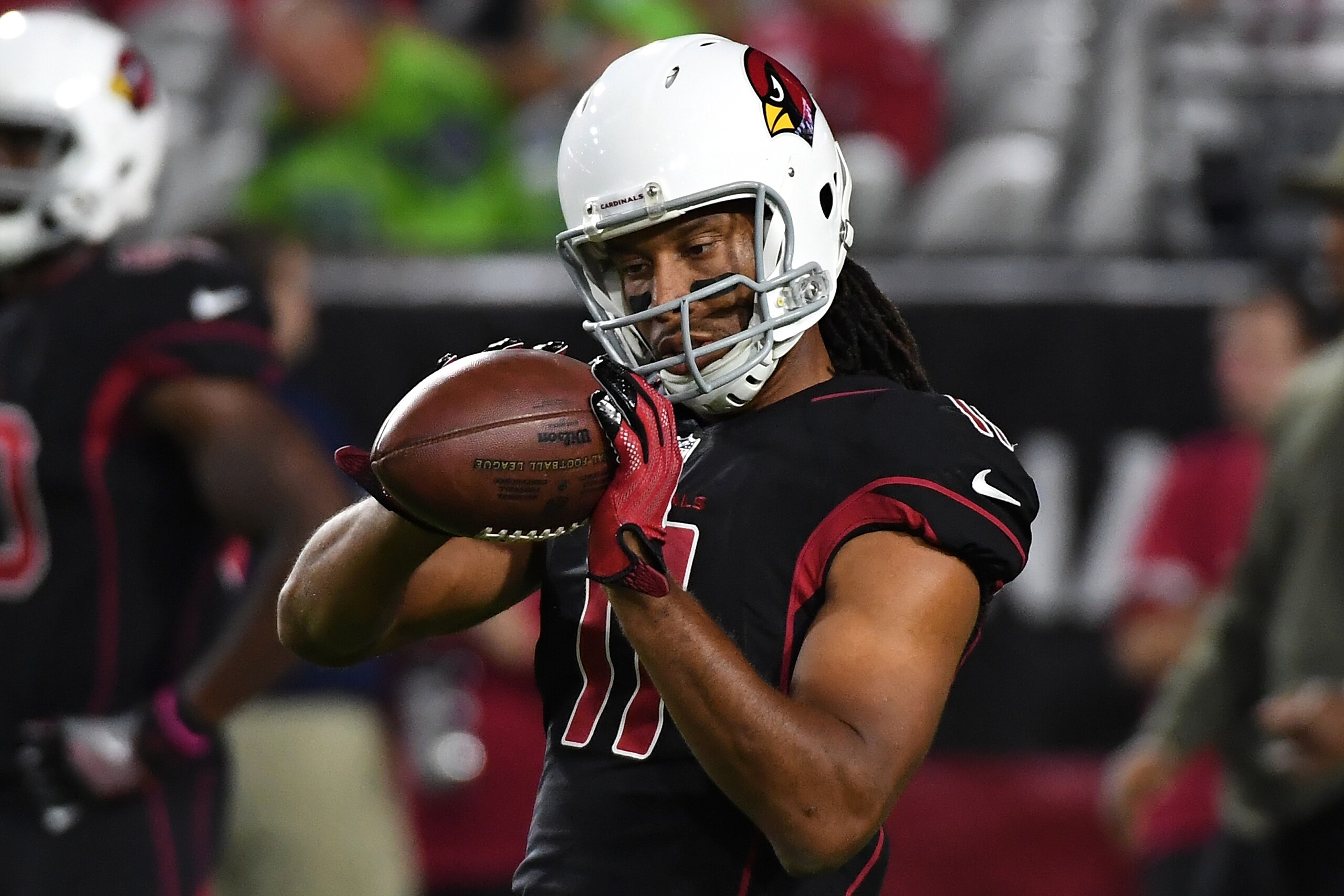 GLENDALE, AZ - NOVEMBER 09:  Larry Fitzgerald #11 of the Arizona Cardinals catches a pass while preparing for a game against the Seattle Seahawks at University of Phoenix Stadium on November 9, 2017 in Glendale, Arizona.  (Photo by Norm Hall/Getty Images)