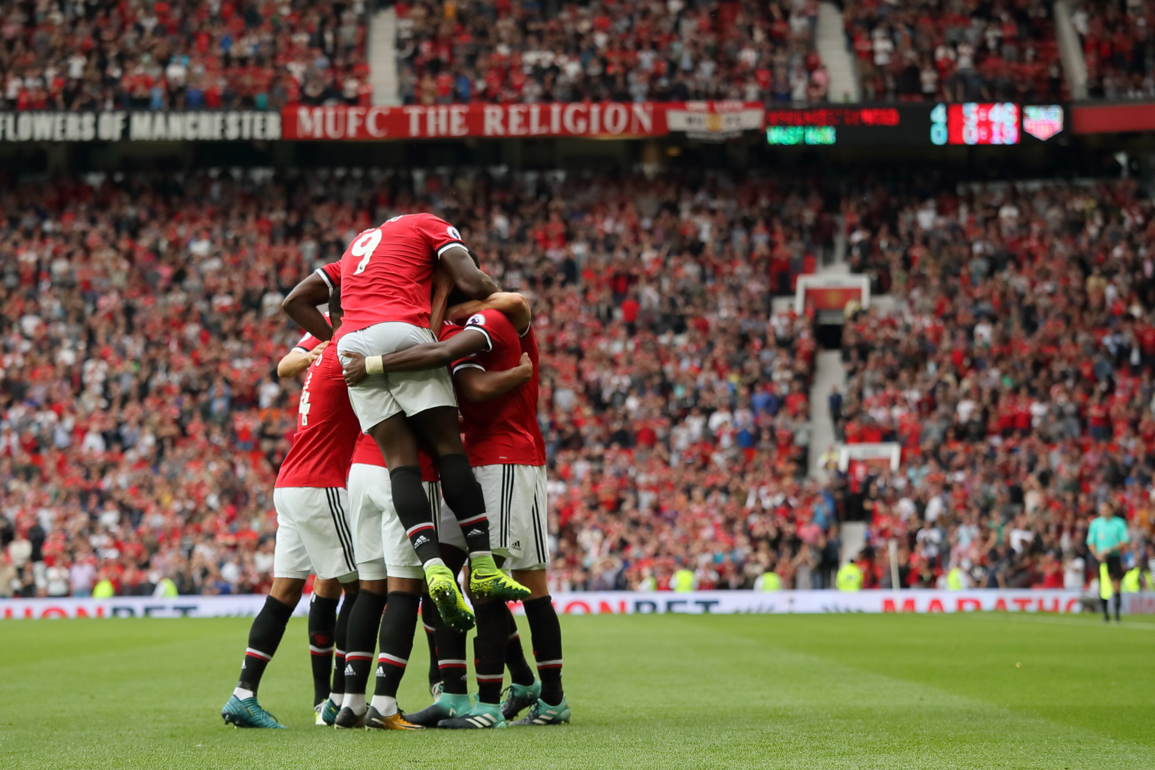 MANCHESTER, ENGLAND - AUGUST 13: Paul Pogba of Manchester United celebrates after scoring a goal to make it 4-0 during the Premier League match between Manchester United and West Ham United at Old Trafford on August 13, 2017 in Manchester, England. (Photo by Matthew Ashton - AMA/Getty Images)